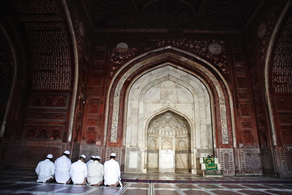 Muslim men praying in the mosque