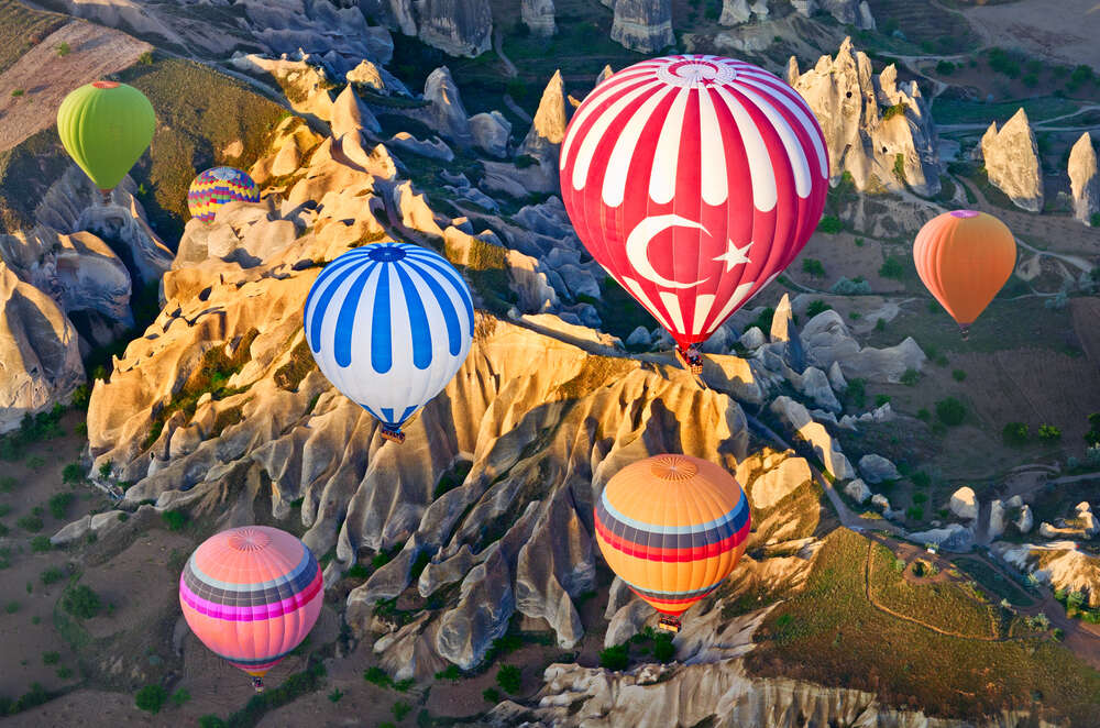 Hot air balloons over mountain