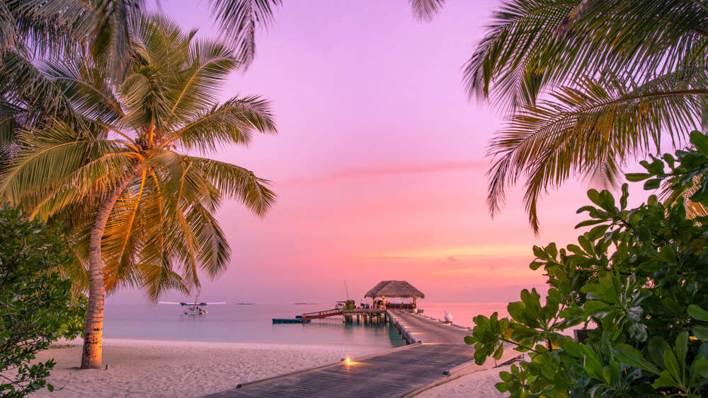 Maldives resort island in sunset